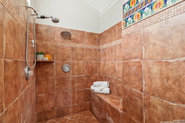 bathroom with tiled shower