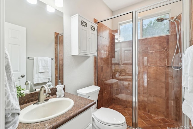 full bathroom with toilet, a shower stall, and vanity