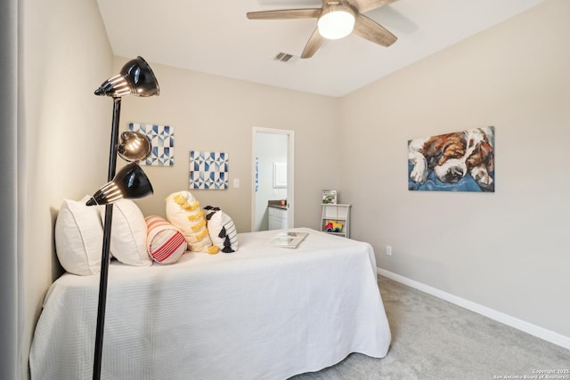 carpeted bedroom featuring ensuite bathroom and ceiling fan