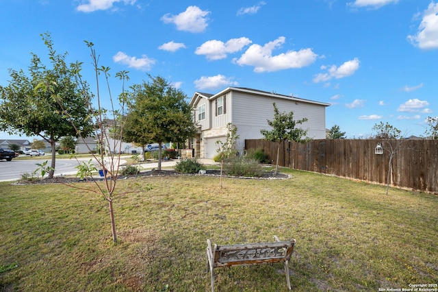 view of yard featuring a garage