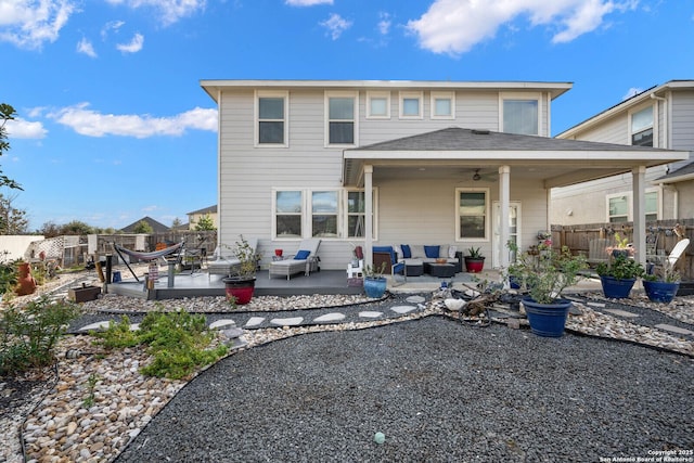 back of house with ceiling fan, a patio, and an outdoor hangout area