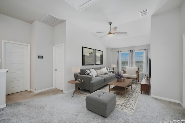 living room featuring ceiling fan, light carpet, and a high ceiling