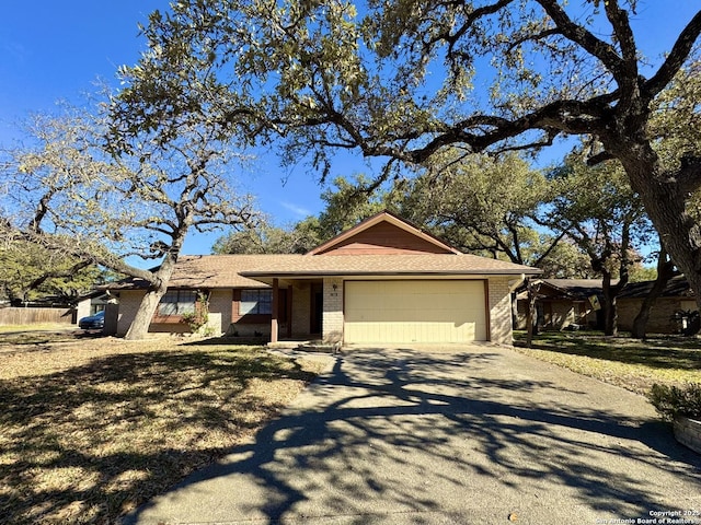 single story home featuring a garage