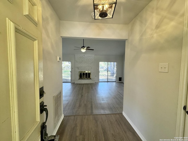 hallway with dark hardwood / wood-style flooring