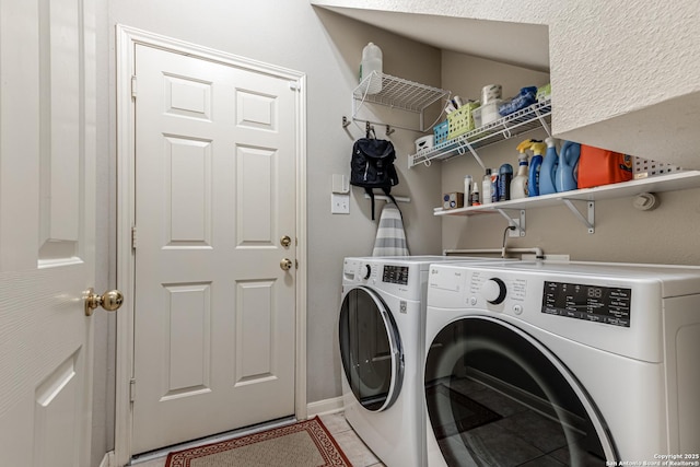 washroom featuring light tile patterned floors and independent washer and dryer