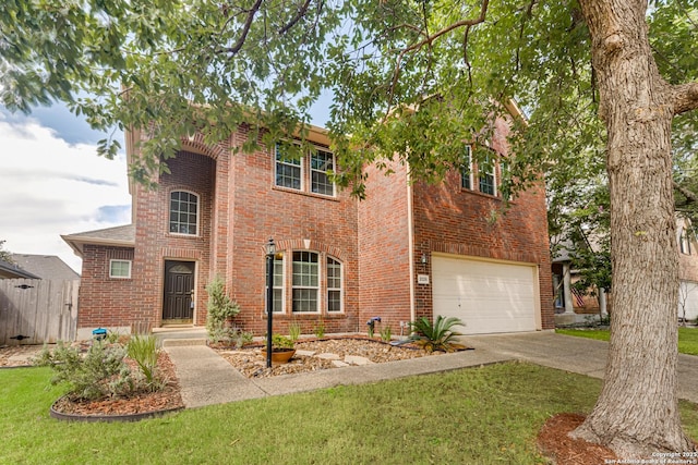 view of front facade with a garage and a front lawn