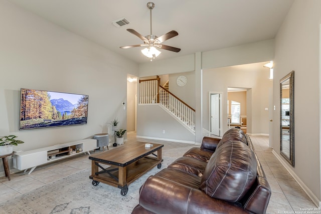 living room with ceiling fan and light tile patterned floors