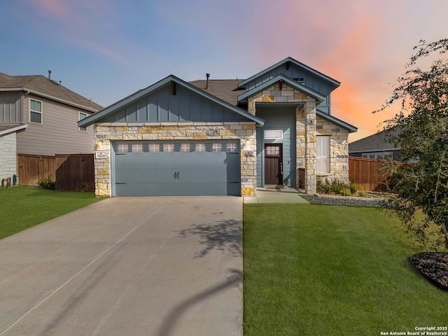 view of front of property featuring a yard and a garage