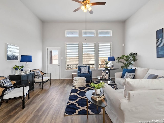 living room with hardwood / wood-style floors and ceiling fan