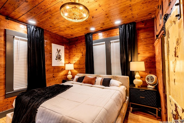 bedroom with light wood-type flooring, log walls, and wood ceiling