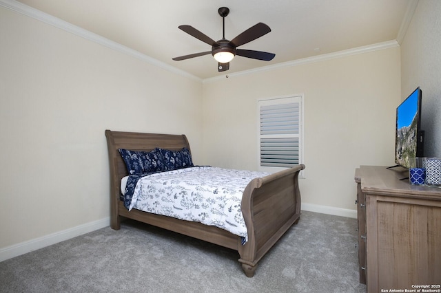 bedroom with ceiling fan, ornamental molding, and carpet