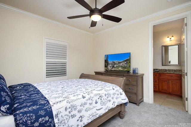 bedroom with light carpet, connected bathroom, ceiling fan, and crown molding