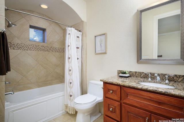 full bathroom with tile patterned floors, shower / tub combo with curtain, vanity, and toilet