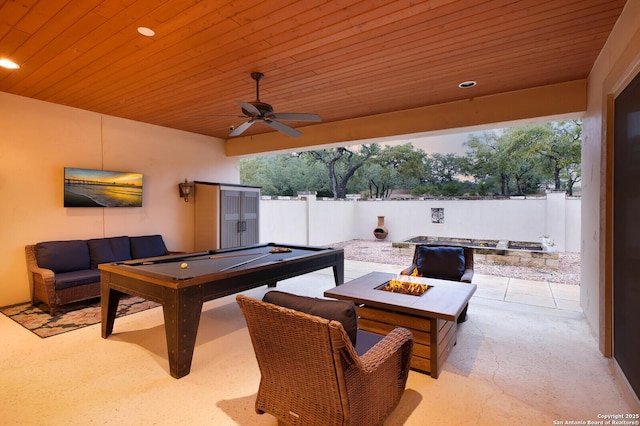 view of patio featuring a fire pit and ceiling fan