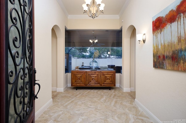 interior space with a notable chandelier and crown molding