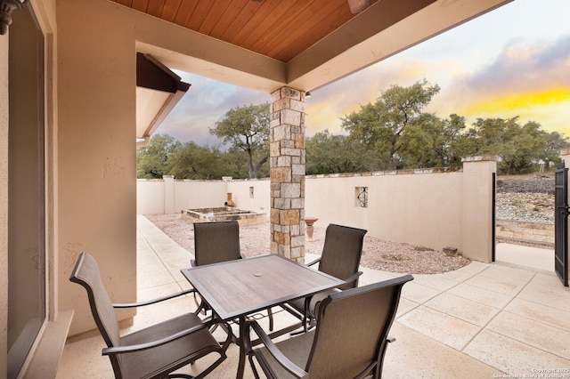 view of patio terrace at dusk