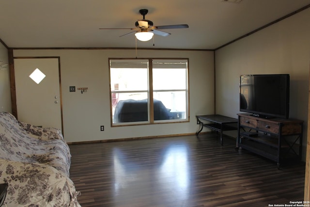 living room with dark wood-type flooring, ceiling fan, and ornamental molding