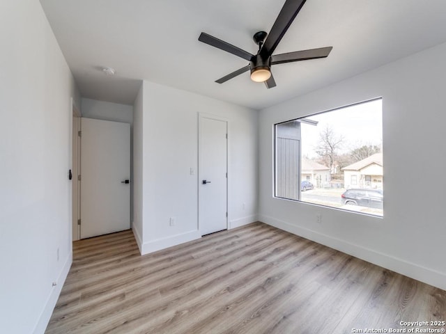 unfurnished bedroom featuring a closet, ceiling fan, and light hardwood / wood-style floors