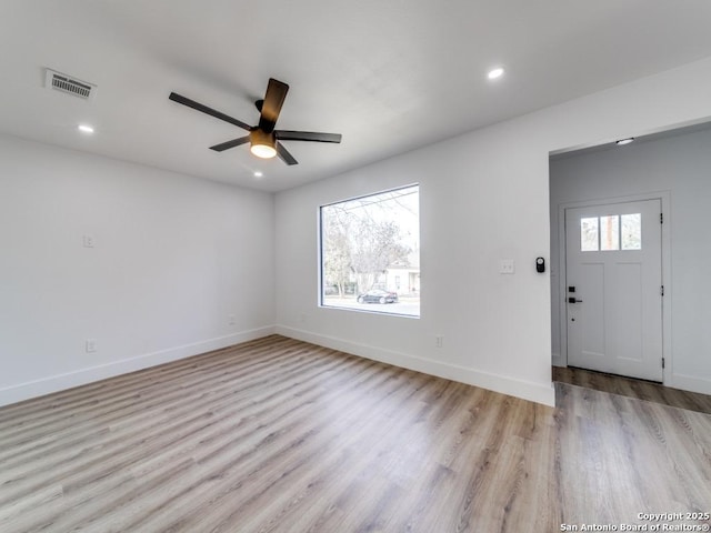 entryway featuring ceiling fan, light hardwood / wood-style flooring, and a healthy amount of sunlight