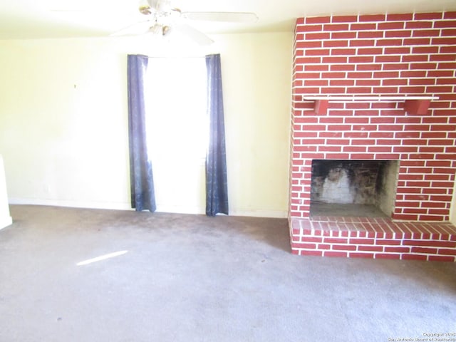 unfurnished living room featuring a fireplace and carpet