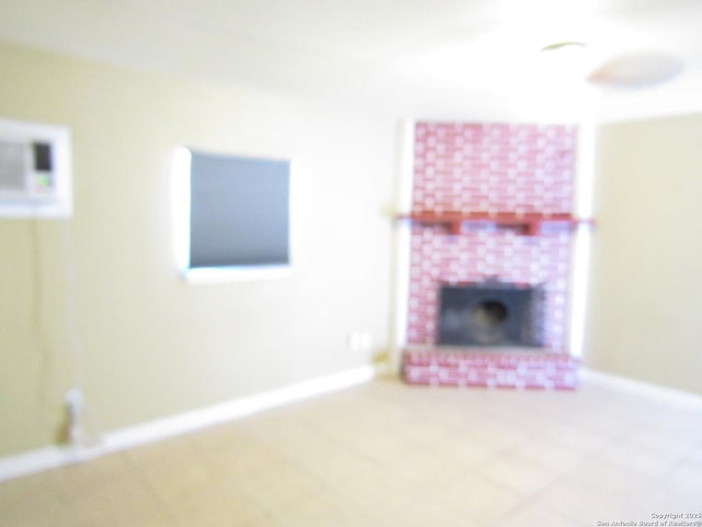 unfurnished living room with a brick fireplace