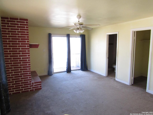 unfurnished living room with ceiling fan and carpet floors