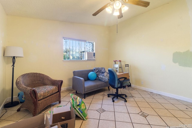 tiled office space featuring ceiling fan