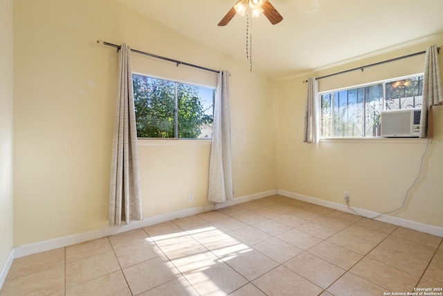 tiled spare room with lofted ceiling, cooling unit, and ceiling fan