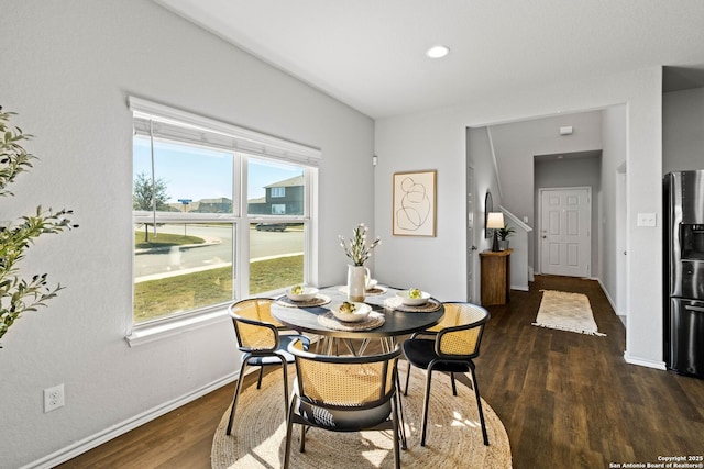 dining room with dark hardwood / wood-style flooring