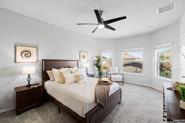 carpeted bedroom with ceiling fan