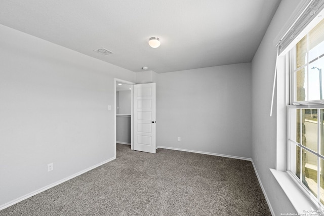 unfurnished bedroom with carpet flooring