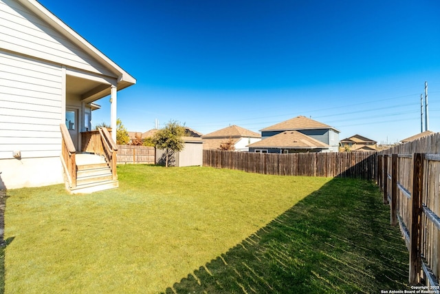 view of yard with a storage shed