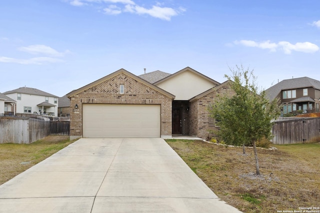 view of front of house featuring driveway, brick siding, an attached garage, and fence