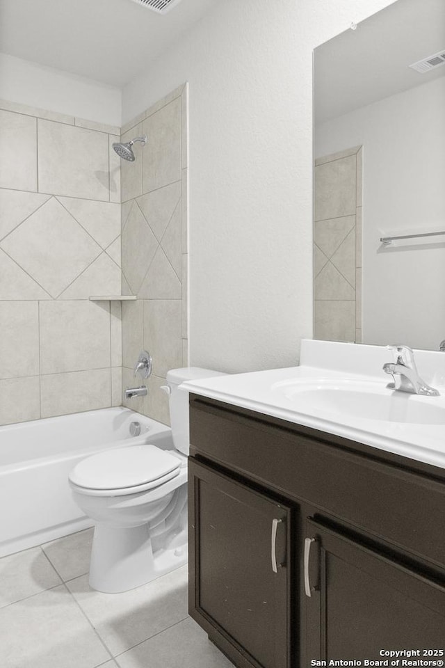 bathroom featuring visible vents, toilet, tile patterned flooring, tub / shower combination, and vanity