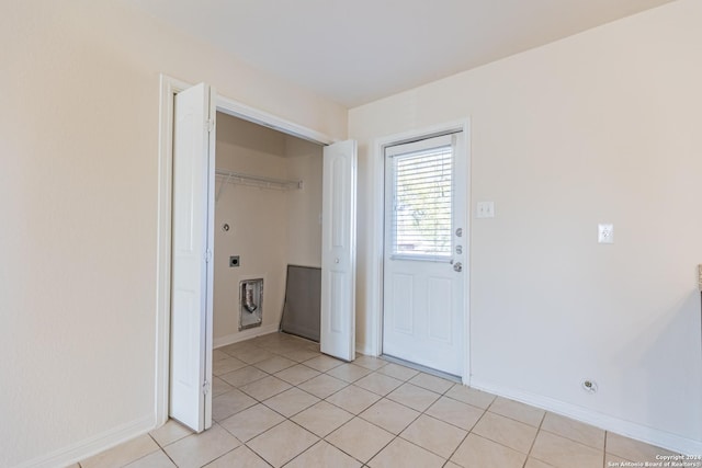 unfurnished room with light tile patterned floors