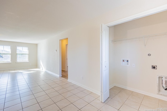 laundry area with electric dryer hookup, hookup for a washing machine, light tile patterned flooring, and hookup for a gas dryer