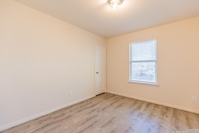 unfurnished room with light hardwood / wood-style flooring