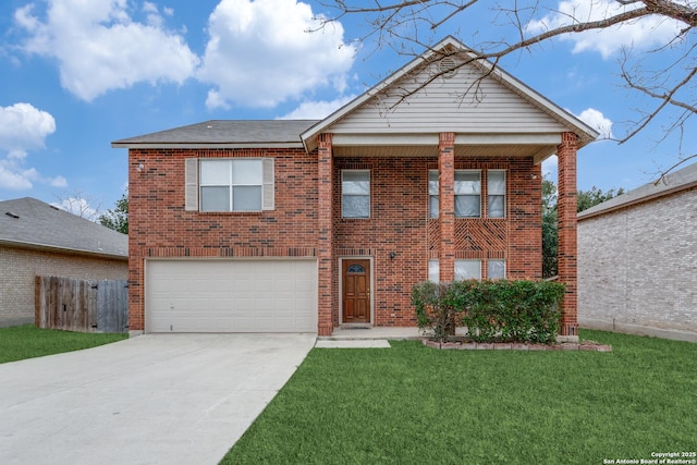 view of front of property with a front yard and a garage