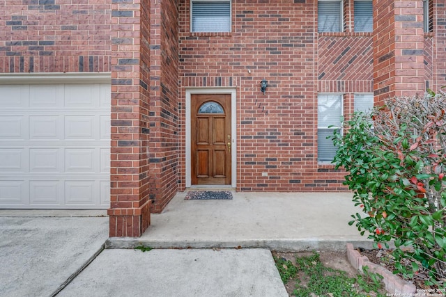 entrance to property featuring a garage