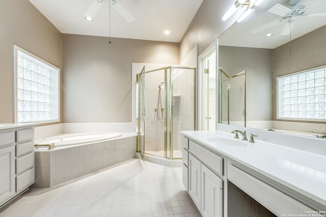 bathroom featuring shower with separate bathtub, vanity, ceiling fan, and a wealth of natural light