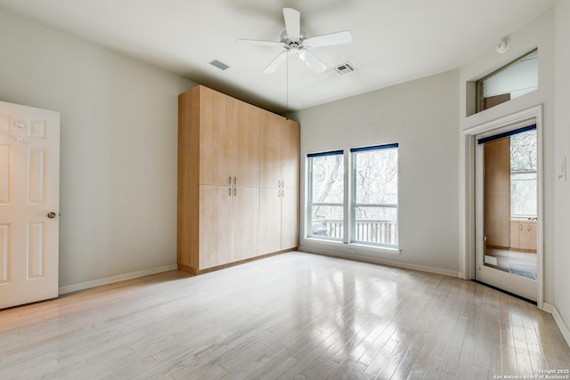 unfurnished bedroom with ceiling fan and light hardwood / wood-style floors