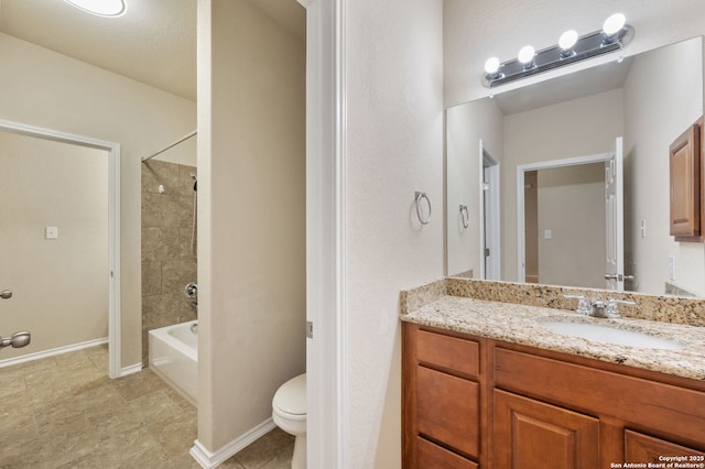 full bathroom with tile patterned floors,  shower combination, vanity, and toilet