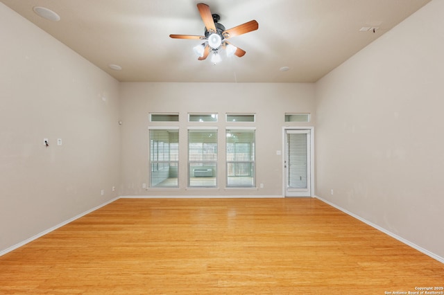 unfurnished room featuring ceiling fan and light wood-type flooring