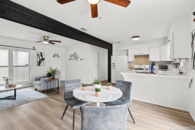 dining space featuring light hardwood / wood-style floors