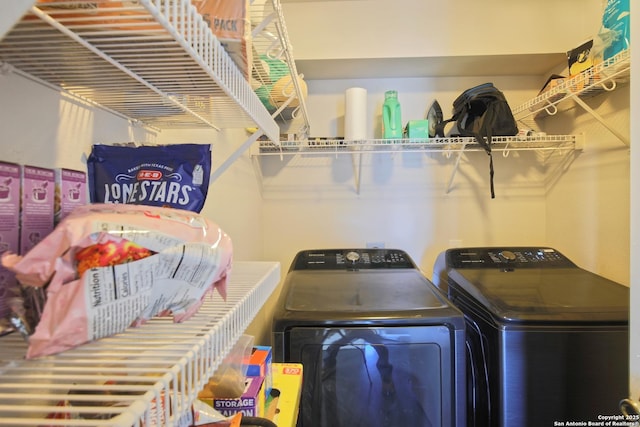 laundry room featuring separate washer and dryer