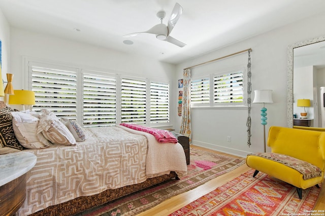 bedroom featuring wood-type flooring and ceiling fan