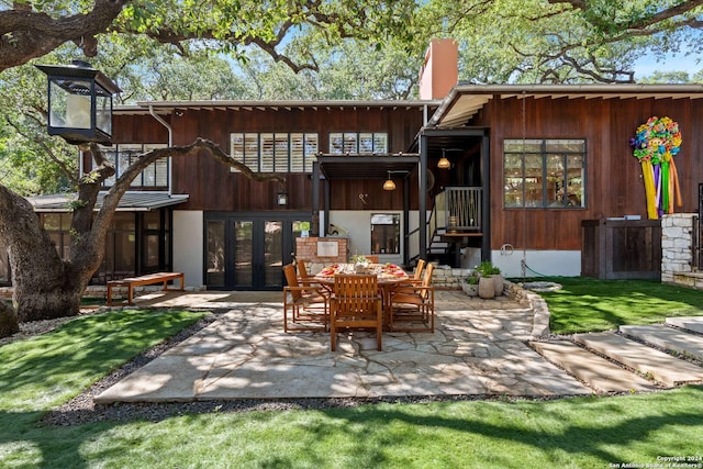 rear view of house with french doors and a patio