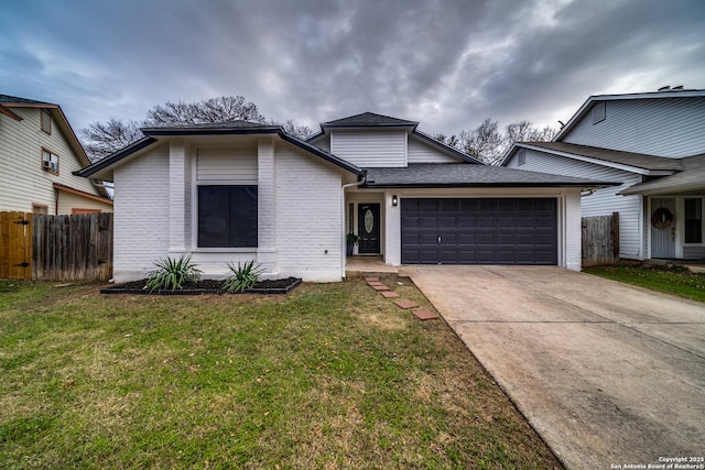 view of front facade with a front lawn and a garage