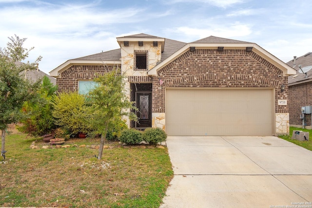 view of front facade with a front lawn and a garage