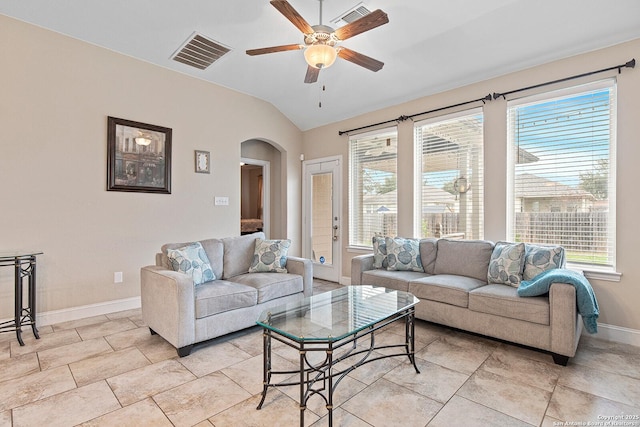 living room featuring ceiling fan and lofted ceiling